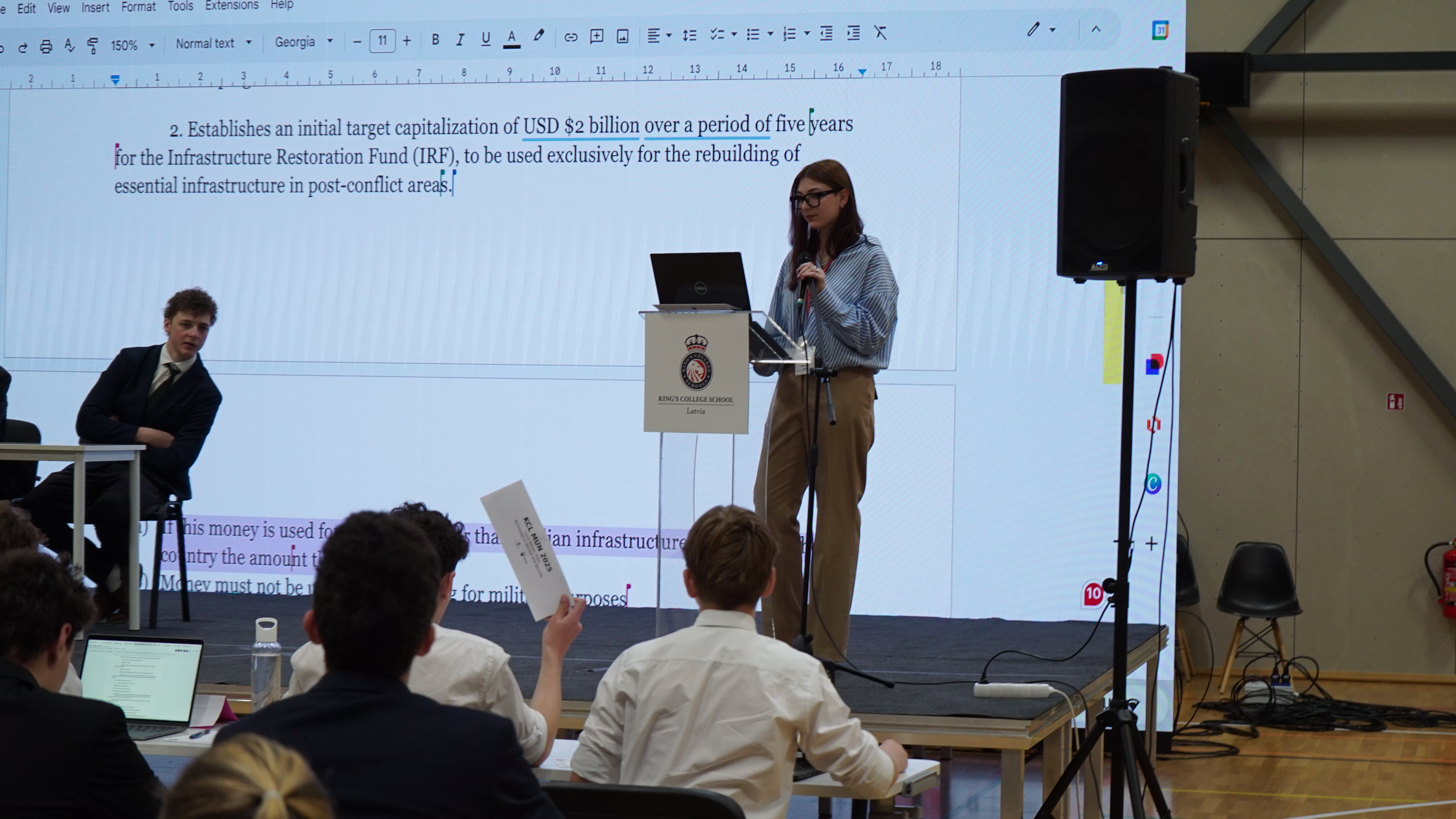 Delegates collaborating during a break