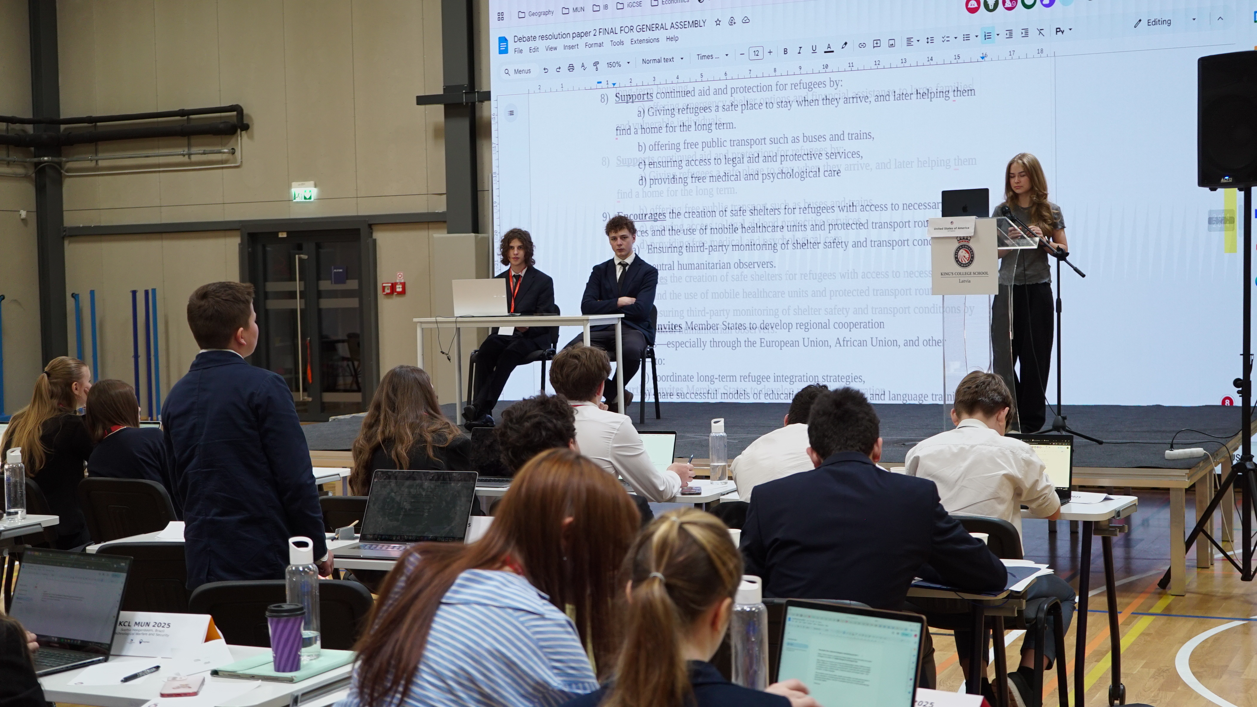 Delegates applauding at closing moments